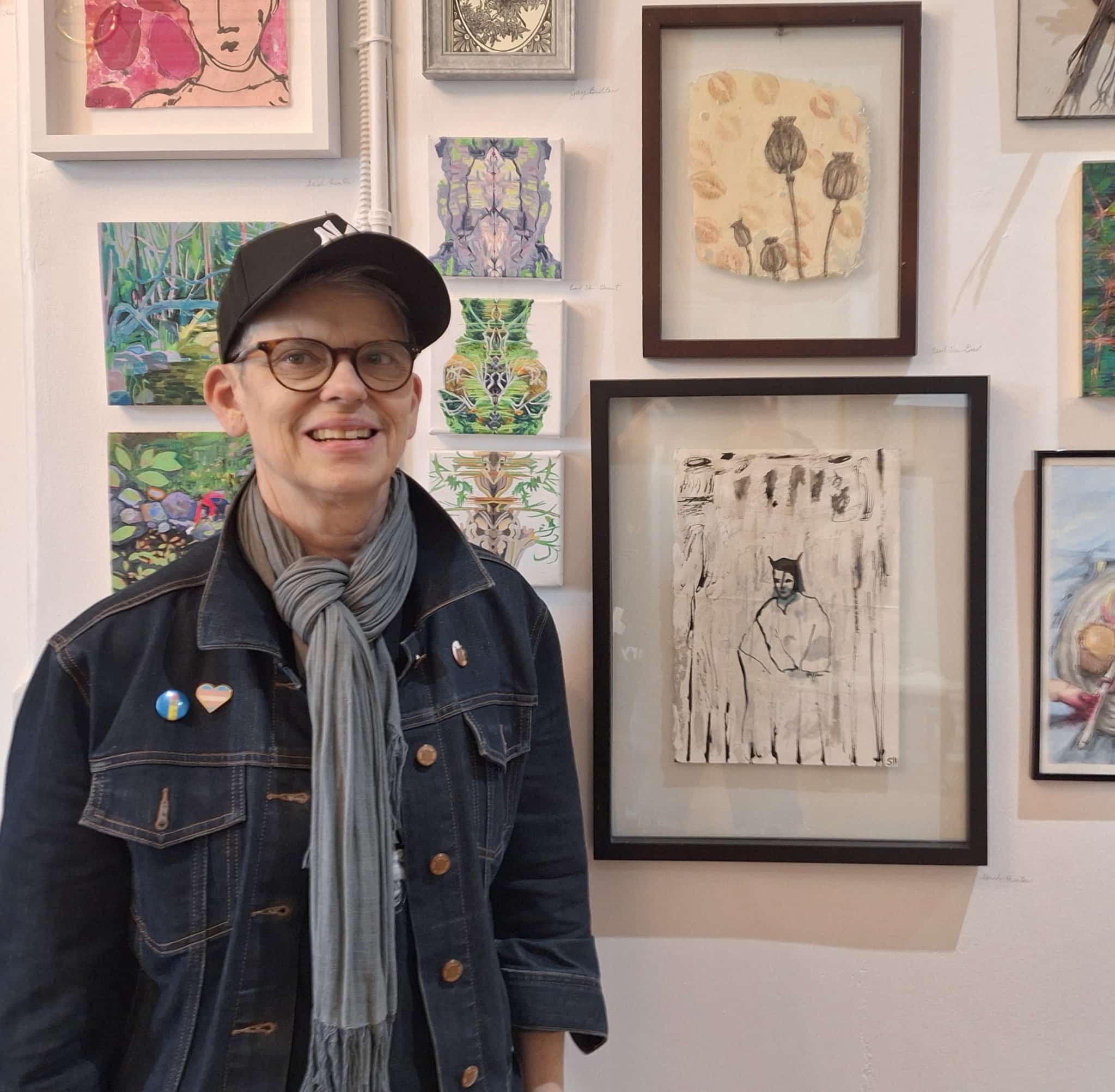 Sarah standing with her pieces at Foy House Art Opening, Nuit Rose, 2026